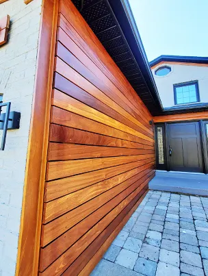 A modern exterior accent wall made from premium Ipe hardwood.