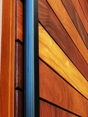 A rainscreen system with structural strapping behind the Ipe hardwood.