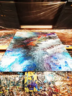A custom abstract acrylic painting displayed in a home, showing its perfect fit for the space.