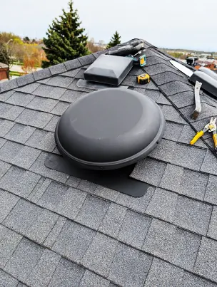 Expert flashing and sealing around a newly installed attic fan.