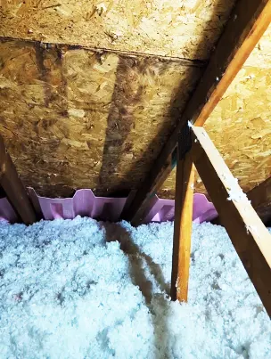 Owens Corning baffles installed to ensure proper attic air intake.