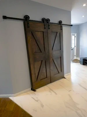 Custom double barn doors made from solid wood and steel.