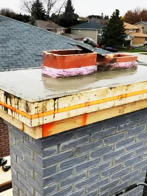 A newly poured, steel-reinforced concrete chimney crown.