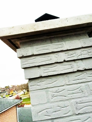 Close-up of a properly formed drip edge on a new chimney crown.
