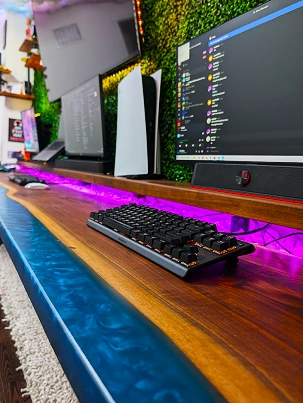 A 12-foot floating desk made from black walnut and epoxy