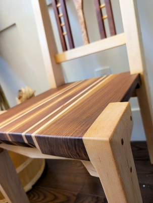 A finished, custom-built chair made from exotic hardwoods