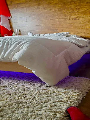 A custom-built floating bed with LED underlighting
