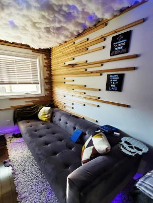 A horizontal Cedar accent wall providing texture and warmth to a custom gaming room.