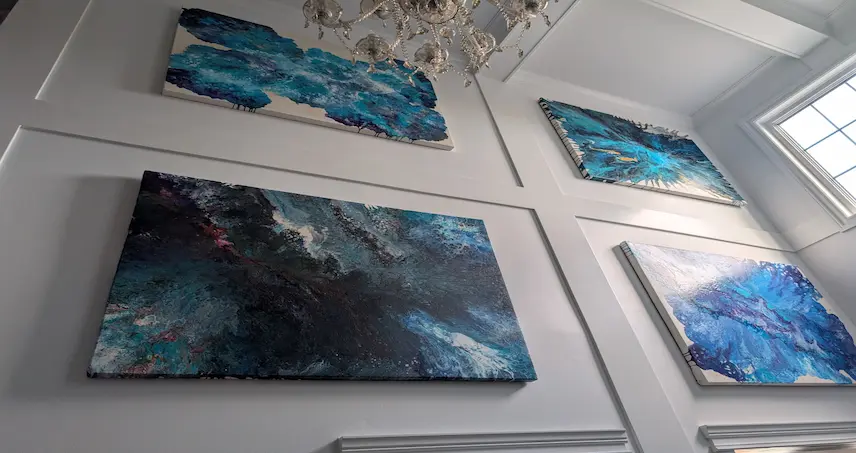 A collage of artisanal pieces, including custom art and charcuterie boards.
