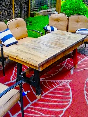 Sleek and durable outdoor table with a dark finish