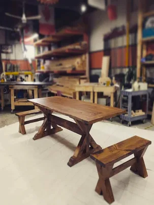 A classic pine farmhouse table with a trestle base