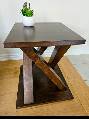 A solid wood side table with complex joinery.