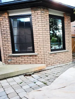 A brick wall with freshly repointed mortar, showcasing restored curb appeal.