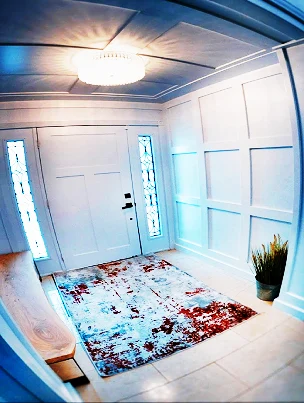 Elegant custom wall panelling in a grand foyer.