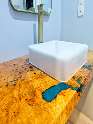 Floating vanity base constructed with solid wood to create an airy illusion