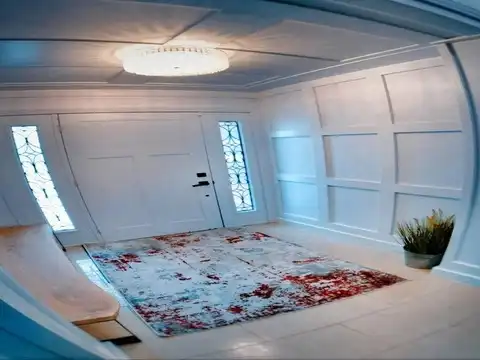 Grand entryway with custom wall panelling